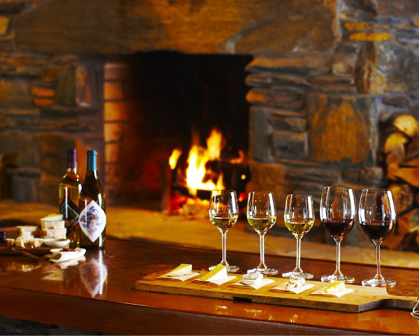 Wine and cheese by fireplace